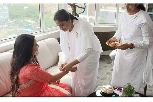 Tying Sacred Rakhi to Axis Bank Vice-President and Actor-Singer Mrs. Amruta Fadnavis ji